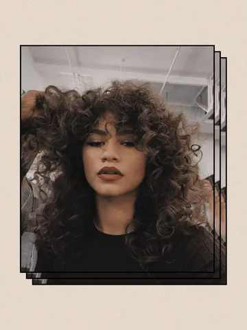 long natural curly hairstyles with bangs