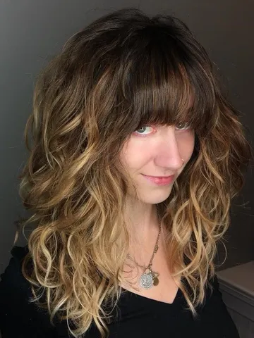 long layered haircuts with bangs for wavy hair