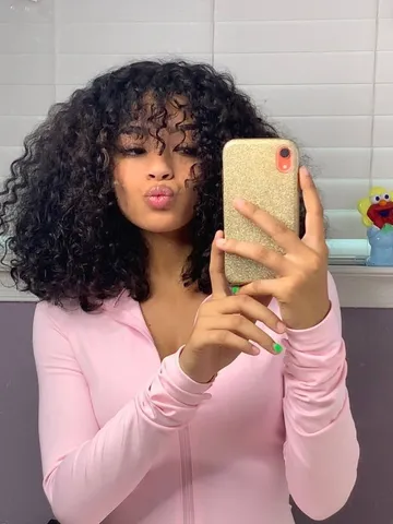 natural black curly hairstyles with bangs