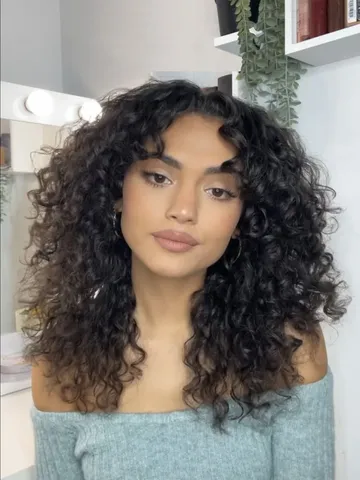 21 best ways to get curtain bangs for curly hair right now a
