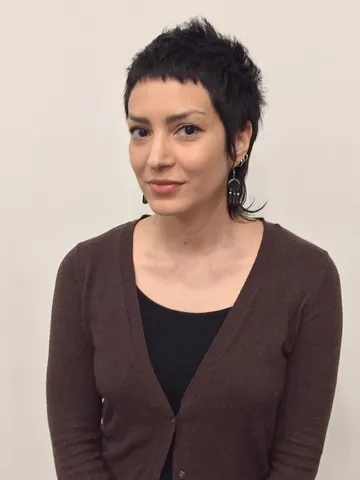 edgy modern textured mullet with choppy micro bangs and blac