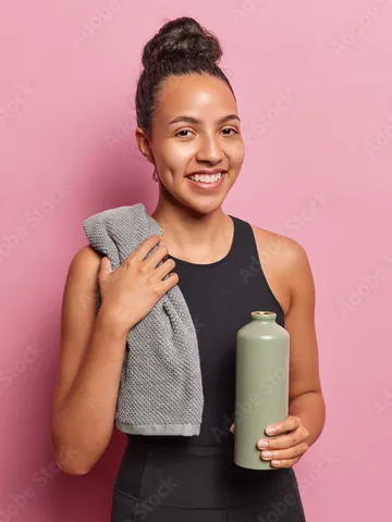 positive smiling latin woman with hair bun smiles gladfully