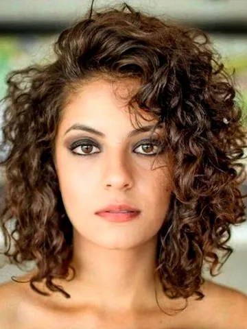 medium length curly haircuts for oval faces
