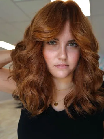 22 flattering ways to pair curtain bangs with curly hair