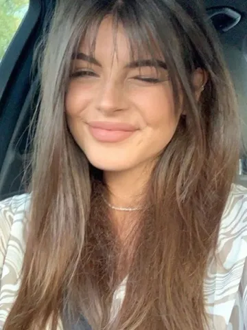 Medium Haircut With Wispy Bangs