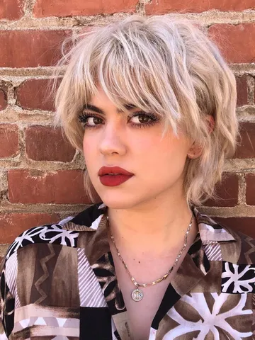 platinum short shaggy bob with messy wavy texture and fringe