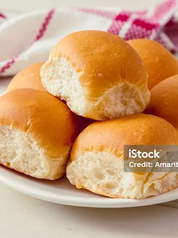 soft bread rolls on white plate stock photo download image n