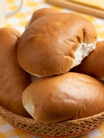 premium photo traditional dutch white soft buns in a basket