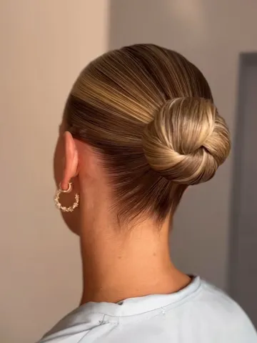slicked back midi bun no face framing probable middle part i